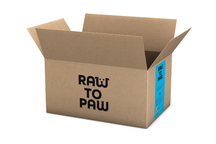 Cardboard box labeled 'RAW TO PAW,' showcasing premium raw pet food delivery for cats.