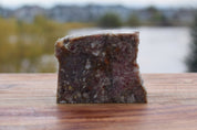 Raw pet food slice made from turkey, beef, bison, and vegetables, perfect for dogs and cats.