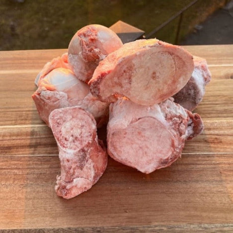 Fresh frozen raw beef bones, including marrow and knuckle, perfect for pets' dental health and bone broth.
