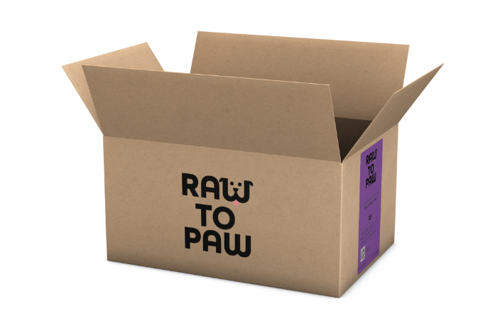 Cardboard box labeled 'RAW TO PAW' for delivering premium pet food directly to your door.